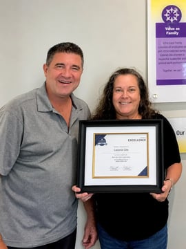 Catania's Sr. VP of Sales Mark Coleman celebrates Tammy Valdez and her recognition by Brandon Hall Group™ for its HCM Excellence Award® for Best Use of AI for Learning